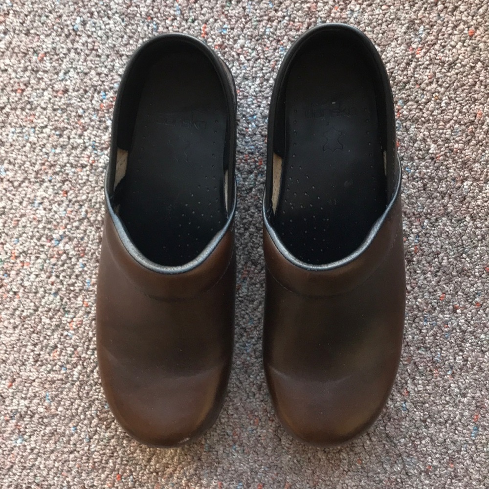 Dansko brown leather clog with black base.